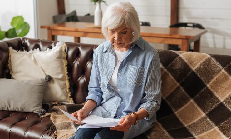 Woman reading bills to pay